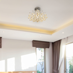 Close-up of the Lyra chandelier's crystal details and polished brass finish, highlighting craftsmanship and materials
