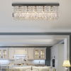 Close-up of the Vela chandelier's rectangular crystal details and sleek metal frame, highlighting craftsmanship and finish