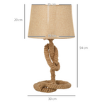 Side view of the Aldeburgh table lamp on a side table, emphasising its elegant proportions and natural fibres
