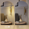 Hatton wall sconce paired with minimalist decor, demonstrating its versatile style and warm light in a lounge area