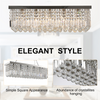 Vela chandelier in a minimalist interior, illustrating its versatile design and luxurious crystal accents