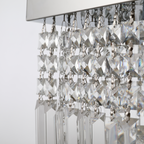 Vela modern chandelier with rectangular crystals, installed in a sophisticated hallway with ambient lighting