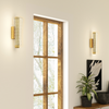 View of the Hatton brushed gold wall sconce from below, highlighting its geometric design and elegant presence in a hallway
