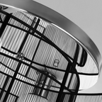 Angle view of the Kura flush mount ceiling light in a modern kitchen, highlighting its sleek profile and finish