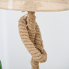 The Aldeburgh lamp placed on a sideboard in a stylish lounge, highlighting its natural materials and warm glow