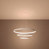 Side view of the Rio tiered LED halo pendant chandelier in a stylish living room setting, demonstrating its elegant presence