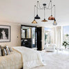 Borough spider cluster chandelier installed in a contemporary bedroom with natural light