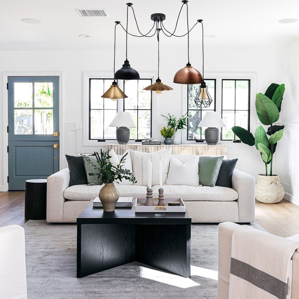 Borough 5-light spider cluster pendant chandelier in a modern living room with white sofa and black coffee table