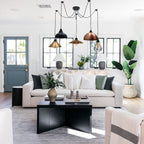 Borough 5-light spider cluster pendant chandelier in a modern living room with white sofa and black coffee table