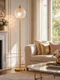 Belsize Gold Tone Floor Lamp with Textured Glass Shade in bright elegant living room