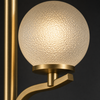Close-up detail of Belsize textured glass shade and gold metalwork