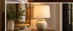 Coraveil cream ceramic table lamp styled on an elegant console table