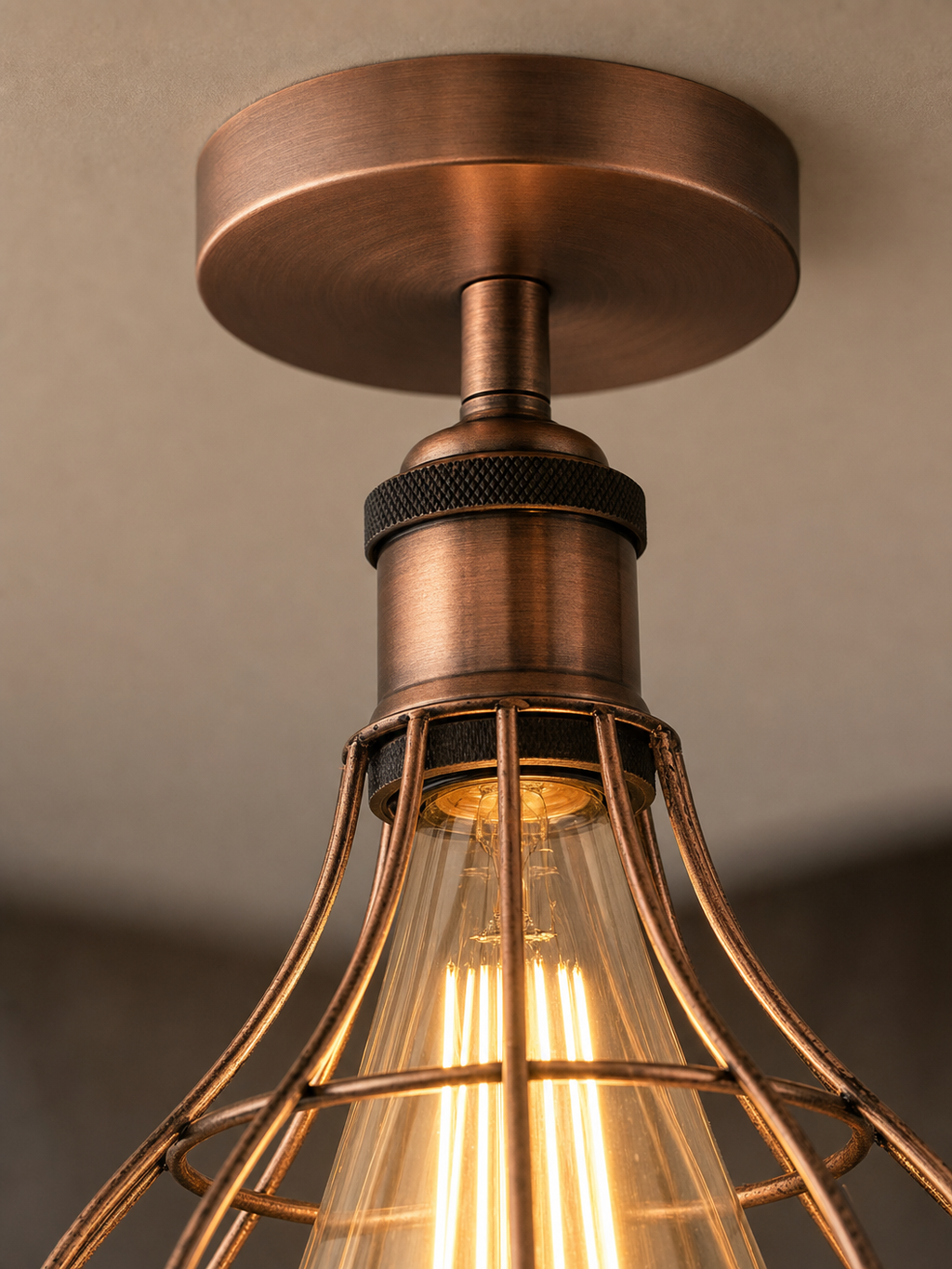 Close-up detail of the Bethnal Green copper wireframe cage and knurled bronze bulb holder