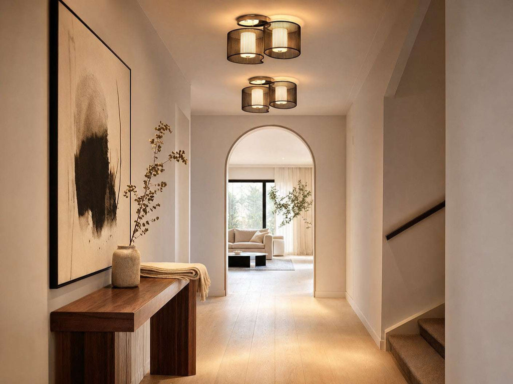Two Kura flush mount ceiling lights in a contemporary hallway with walnut console table and abstract ink artwork