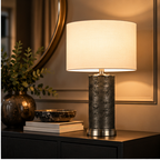 The Linden Lamp styled on a dark console in a warm contemporary interior