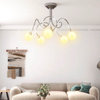 Solace 5-Light Sculptural Semi-Flush Ceiling Lamp in a modern living room setting, showcasing its elegant design and warm lig
