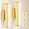 Hatton brushed gold geometric mesh wall sconce by ZYVORAN in a modern living room setting, showcasing elegant wall lighting d