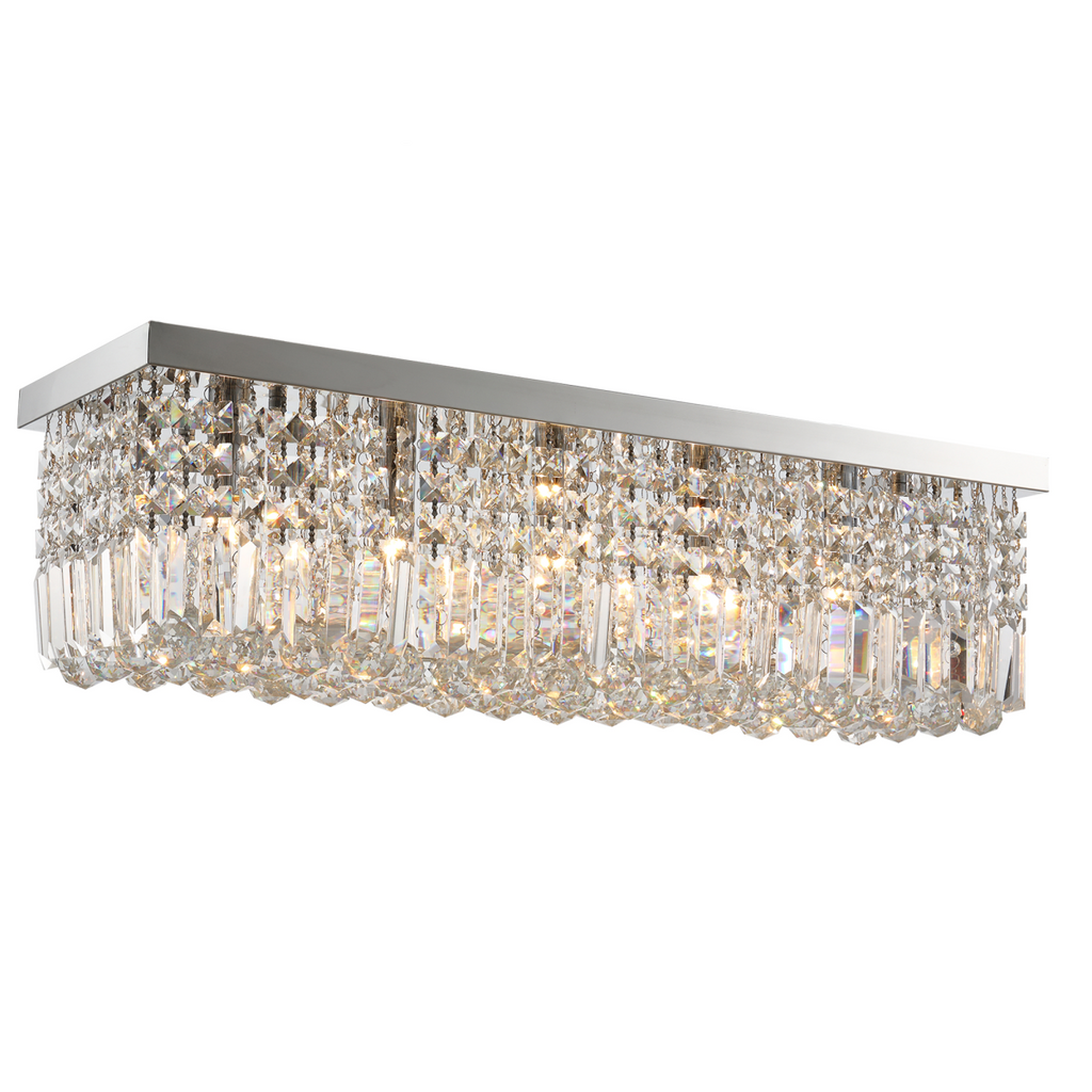 Vela modern rectangular crystal bar chandelier in a contemporary dining room setting, showcasing its elegant design and spark