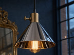 Mercer single chrome cone pendant detail — brass collar, thumbscrew, Edison filament