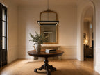 Meridian Square Halo 80x80cm matte black LED pendant chandelier in a classical foyer above a round walnut console