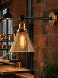 Shoreditch amber glass cone industrial wall sconce mounted on exposed brick in a warehouse kitchen