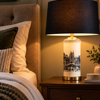 Sonning ceramic cityscape table lamp styled in a warm bedroom