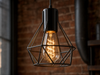 Close-up of Whitechapel diamond wireframe cage shade with Edison filament bulb