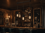 Whitechapel 3-light cage bar pendant above Victorian pub counter with brass taps