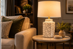Whitlock cream ceramic table lamp styled on a living room side table